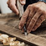 Carpenter carving wood