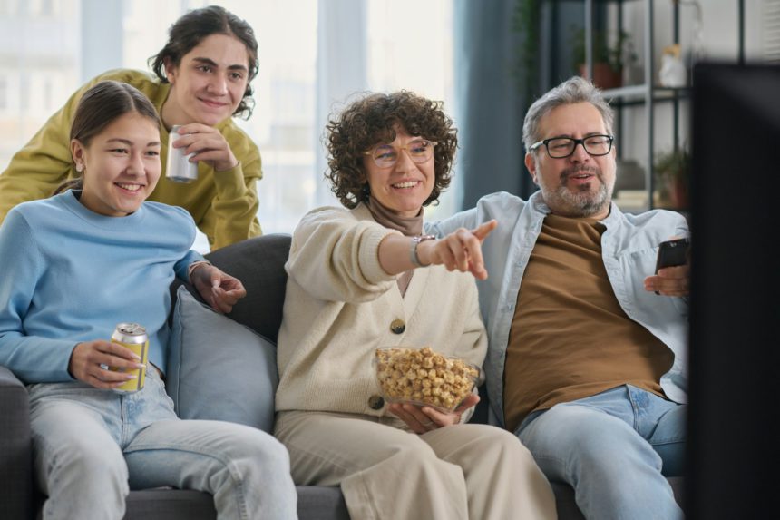 Family enjoying watching movie together