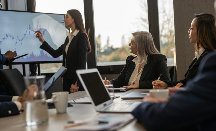 Group of business professionals discussing the latest market trends