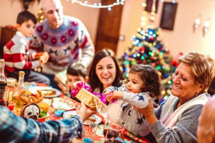 Multi generation big family having fun at christmas supper party