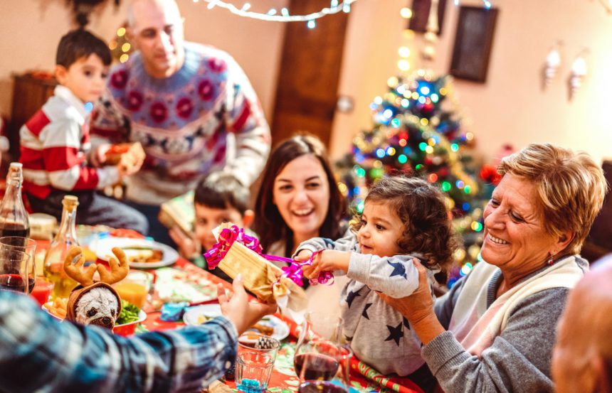 Multi generation big family having fun at christmas supper party